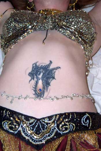 Tatiana's Tatoo of a Dragon circling her belly button.